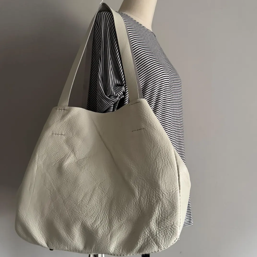 Pale Neutral Oversized Slouchy Shoulder Tote With Plush Fuzzy Front Panel, Multi-Strand Fringe Tassel And Base Protective Metal Studs