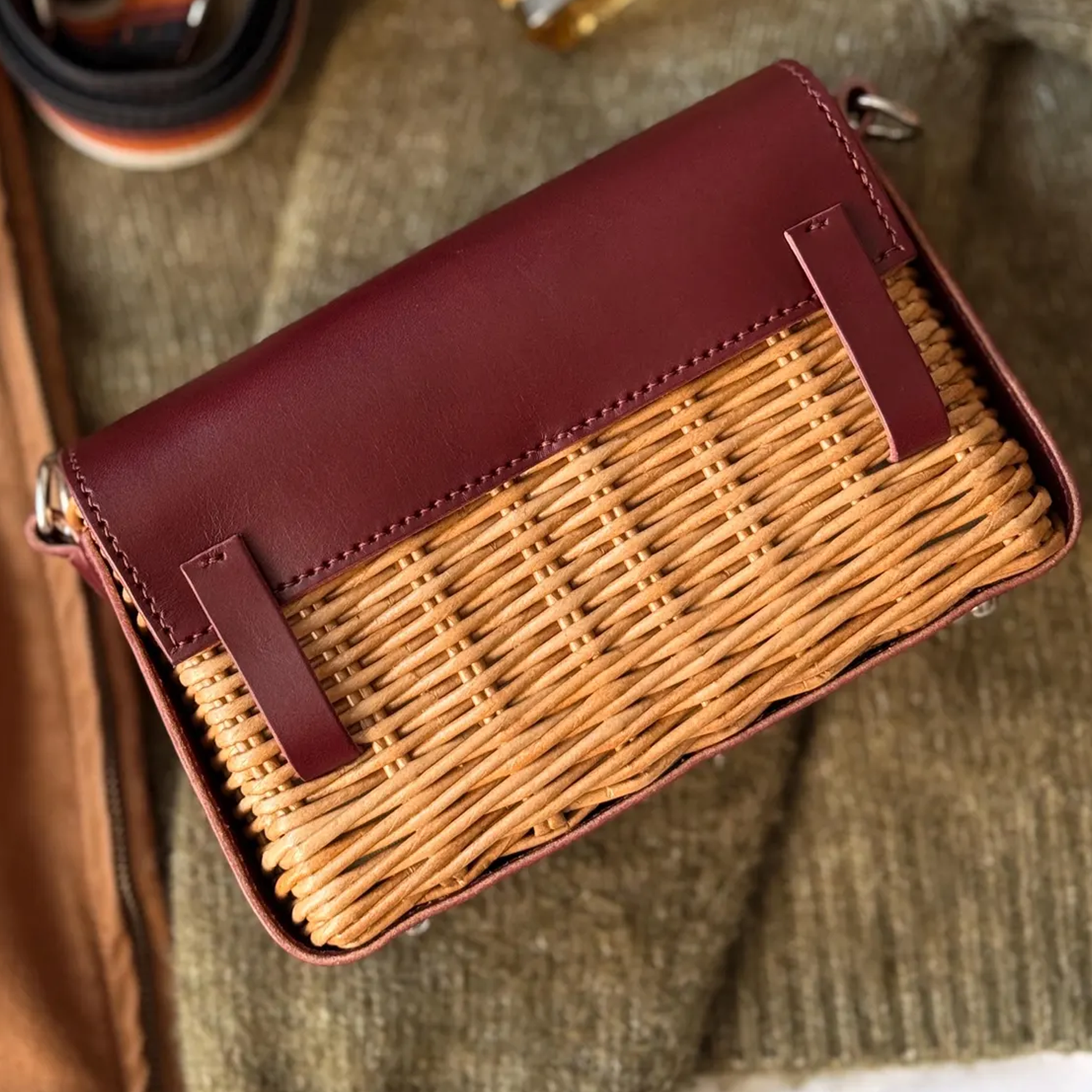 Deep Burgundy Trim Woven Rattan Rectangular Flap Purse With Silvery Twist Lock Hardware And Striped Fabric Shoulder Band